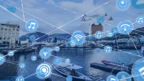 Network-of-digital-icons-and-drone-carrying-a-delivery-box-against-aerial-view-of-the-port-harbor