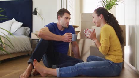 Happy-caucasian-couple-in-love-drinking-coffee-at-home