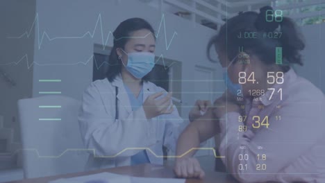 Animation-of-data-processing-over-asian-doctor-and-patient-wearing-face-masks