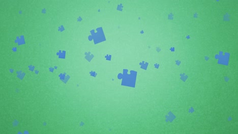 Animation-Von-Blauen-Puzzleteilen,-Die-Auf-Grünen-Hintergrund-Fallen