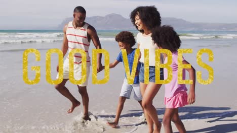 Animation-of-good-vibes-text-over-smiling-african-american-family-walking-at-beach