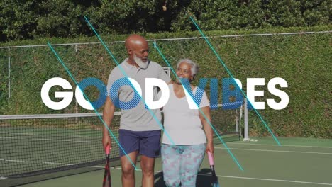 Animation-Von-Text-Mit-Guter-Stimmung-über-Einem-Lächelnden-älteren-Afroamerikanischen-Paar,-Das-Tennis-Spielt