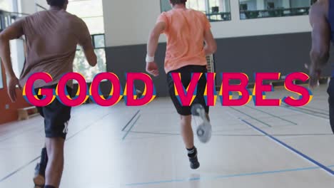 Animation-of-good-vibes-text-over-diverse-sportsmen-at-gym