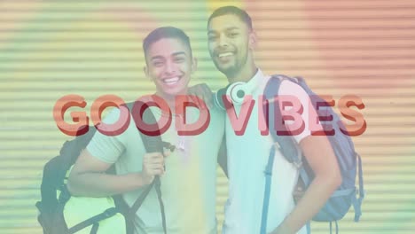 Animation-of-good-vibes-text-over-smiling-biracial-male-friends