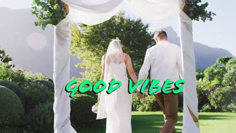 Animation-of-good-vibes-text-over-caucasian-married-couple-holding-hands