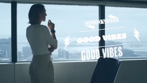 Animation-of-good-vibes-text-over-caucasian-businesswoman