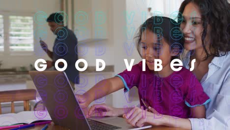 Animation-of-good-vibes-text-over-smiling-biracial-family-using-laptop