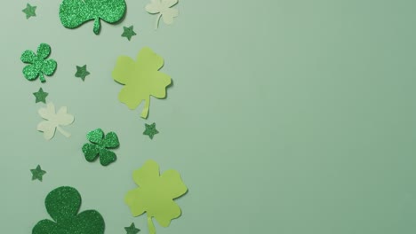 Shamrocks-and-stars-with-copy-space-on-green-background