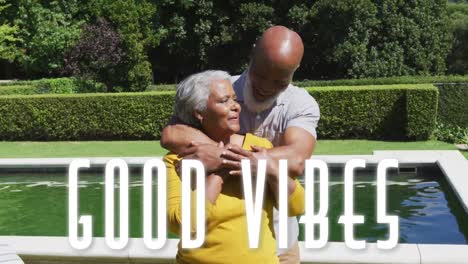 Animation-of-good-vibes-text-over-smiling-senior-african-american-couple-embracing