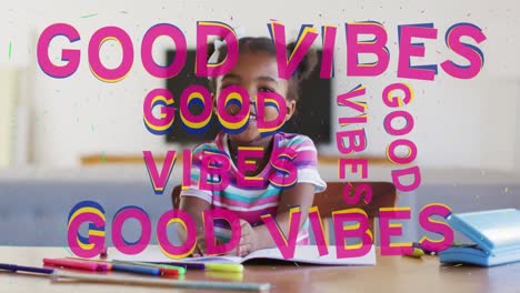 Animation-of-good-vibes-text-over-smiling-african-american-schoolgirl-in-classroom