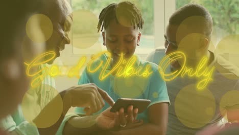 Animation-of-good-vibes-only-text-over-african-american-family-using-smartphone
