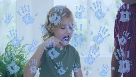 Video-of-handprints-over-caucasian-boy-brushing-teeth