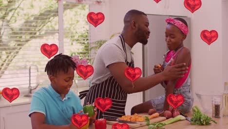 Animation-of-hearts-falling-over-african-american-family-cooking-together-in-the-kitchen