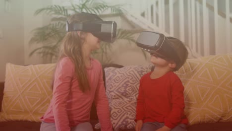 Spots-of-light-against-caucasian-brother-and-sister-wearing-vr-headset-at-home