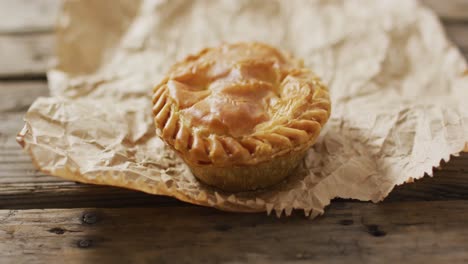 Video-of-pie-seen-from-above-on-wooden-background