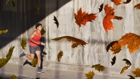 Multiple-leaves-icon-floating-against-african-american-man-running-on-the-street
