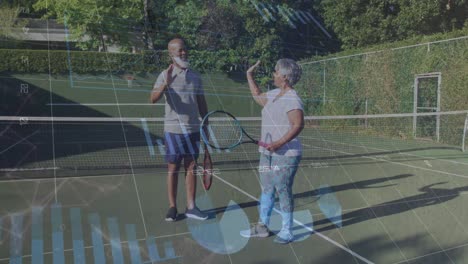 Data-processing-against-african-american-senior-couple-high-fiving-each-other-at-tennis-court