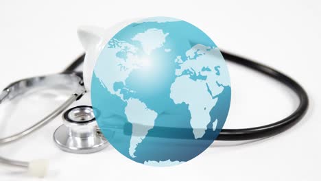 Composite-video-of-earth-over-close-up-of-stethoscope-against-white-background