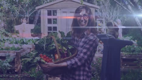 Light-trials-against-portrait-of-caucasian-woman-with-basket-full-of-vegetables-in-the-garden