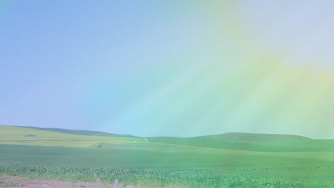 Video-of-rainbow-fog-over-moving-countryside-landscape