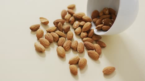 Video-of-almonds-in-a-bowl-on-white-background