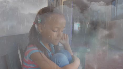 Composite-video-of-rainfall-and-thunderstorms-against-stressed-african-american-girl-at-school