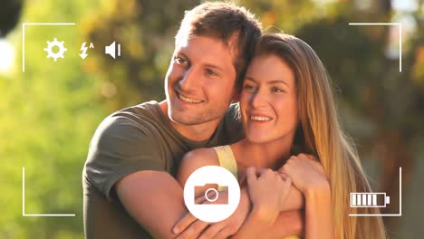 Animation-of-video-play-screen-over-hugging-caucasian-couple
