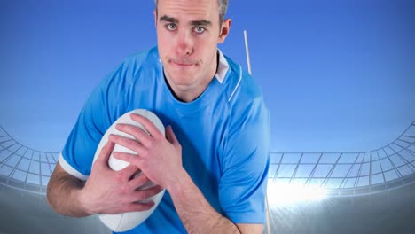Animation-of-caucasian-male-rugby-player-holding-ball-over-stadium