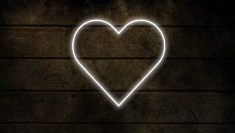 Animation-of-glowing-neon-heart-icon-on-brick-wall