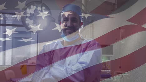Animation-of-american-flag-over-caucasian-male-doctor-smiling