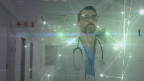 Animation-of-networks-of-connections-over-caucasian-doctor-in-hospital