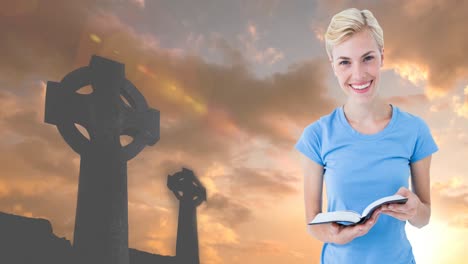 Animation-of-caucasian-woman-holding-holy-bible-and-crucifixes-at-sunset