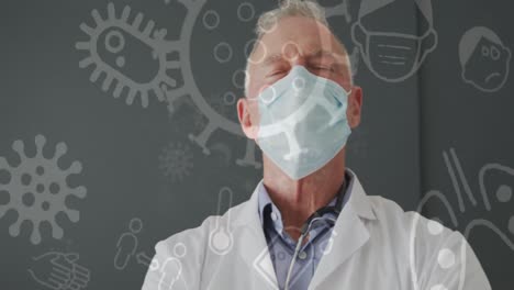 Animation-of-medical-icons-over-caucasian-male-doctor-wearing-face-mask