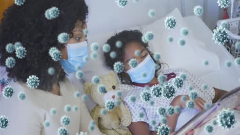 Animation-of-virus-cells-over-african-american-mother-and-daughter-wearing-face-masks