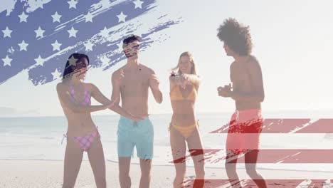 Animation-of-american-flag-over-diverse-group-of-friends-dancing-at-beach