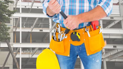 Animation-of-caucasian-male-worker-with-hammer-over-building-site