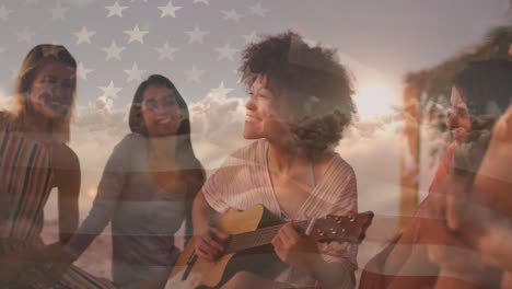 Animation-of-flag-of-united-states-of-america-over-happy-biracial-woman-playing-guitar-on-beach