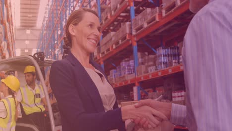 Animation-of-caucasian-female-boss-shaking-hands-with-worker-in-warehouse