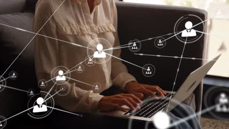 Animation-of-network-of-connections-with-people-icons-over-caucasian-woman-using-laptop