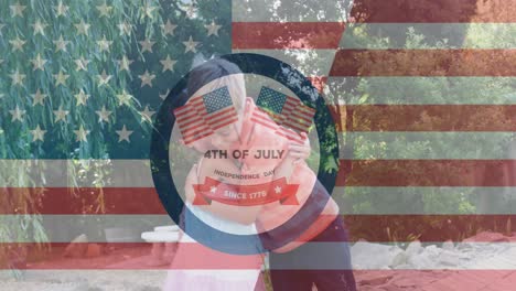 Animation-of-4th-of-july-text-and-flag-of-usa-over-caucasian-boy-and-girl-embracing