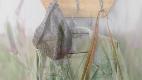 Animation-of-grass-and-plants-over-hanging-clothes