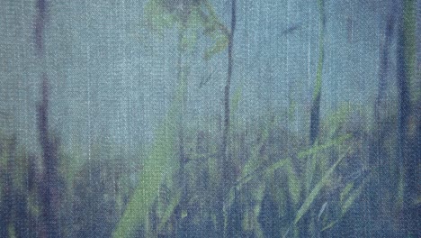 Animation-of-denim-over-moving-flowers-and-grass
