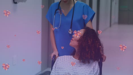 Animation-of-heart-icons-over-happy-biracial-pregnant-woman-talking-with-nurse