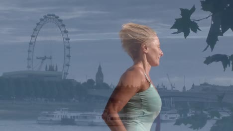 Animation-of-caucasian-female-runner-running-over-cityscape-of-london