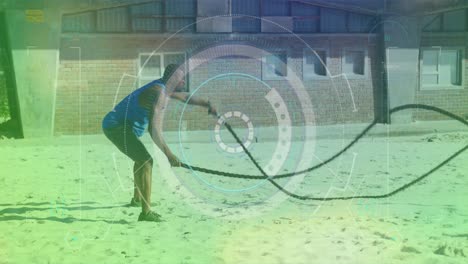 Round-scanner-against-african-american-fit-man-performing-exercise-with-a-rope-at-the-beach