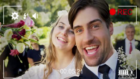 Animation-of-digital-camera-interface-over-caucasian-married-couple-smiling-to-camera