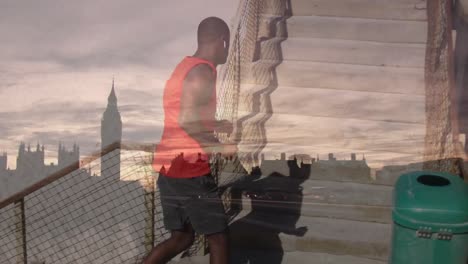 Animation-of-african-american-male-runner-running-over-cityscape-of-london