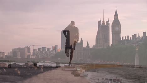 Animation-of-caucasian-male-runner-running-over-cityscape-of-london