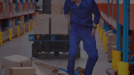 Animation-of-shapes-moving-over-falling-caucasian-male-worker-in-warehouse