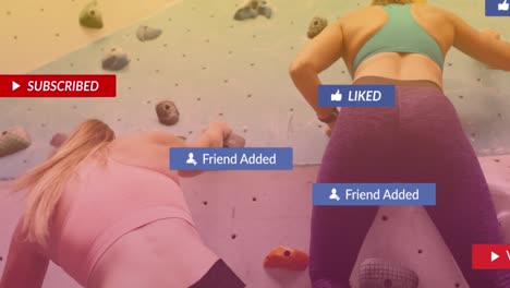 Speech-bubbles-with-digital-icons-against-two-caucasian-fit-women-wall-climbing-at-the-gym